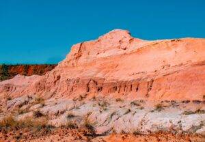 brown rocky mountain under blue sky during daytime